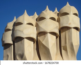 Scenic chymneys on the rooftop of La Pedrera in Barcelona, Spain. The famous luxury house designed by the architect Gaudì. This is a detail of the building also named Casa Milà - Powered by Shutterstock