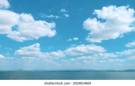 Scenic Clouds And Blue Sky Background. The Natural Beauty Of The Tropical Sea Landscape. Horizon Line Seascape.