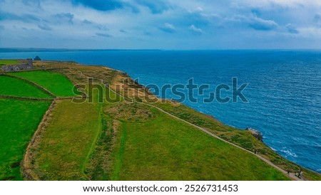 Image, Stock Photo Idyllic coastal landscape with waterfall