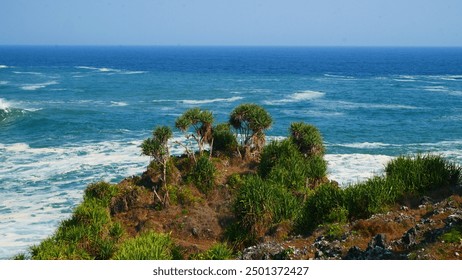 Scenic Coastal Landscape with Lush Green Hills and Clear Blue Sea - Powered by Shutterstock