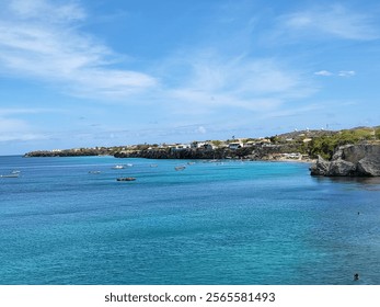 "Scenic Coastal Village with Clear Turquoise Waters and Rocky Shoreline" - Powered by Shutterstock