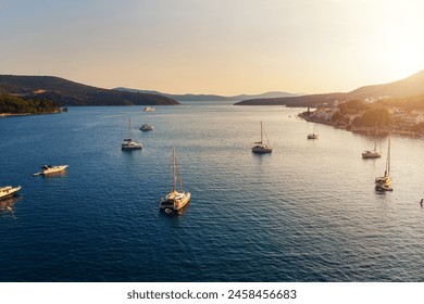 Scenic Croatia Slano aerial above view many yachts boat ships moored at scenic sunrise in Adriatic sea Dalmatia morning sunset evening time. Marina harbor sailboats warm sunlight seascape landscape - Powered by Shutterstock