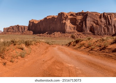 Scenic dirt road in the monuments in the Monument Valley, Arizona USA - Powered by Shutterstock