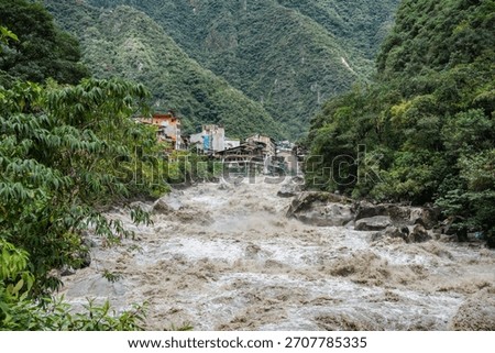 Scenic dramatic view with the powerful waters of Urubamba River crossing the Sacred Valley in Aguas Calientes