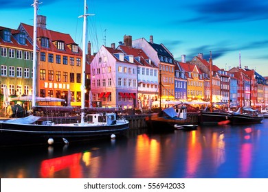 Scenic Evening Panorama Of Famous Nyhavn Pier Architecture In The Old Town Of Copenhagen, Denmark