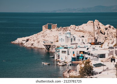 scenic Firopotamos village (traditional Greek village by the sea, the Cycladic-style) with sirmata - traditional fishermen's houses, Milos island, Cyclades, Greece