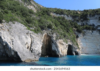 Scenic Greek Islands Landscape: Rock Formations, Cliffs, and Coastal Houses Viewed from the Sea - Powered by Shutterstock