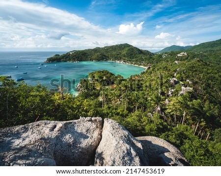 Scenic high angle view of Chalok Baan Kao Bay tropical white sand beach, clear turquoise sea with coral reef against summer blue sky. John Suwan Viewpoint, Koh Tao Island, Surat Thani, Thailand.