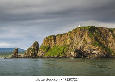 Scenic high rocks in the Pacific Ocean. Kamchatka Peninsula.
