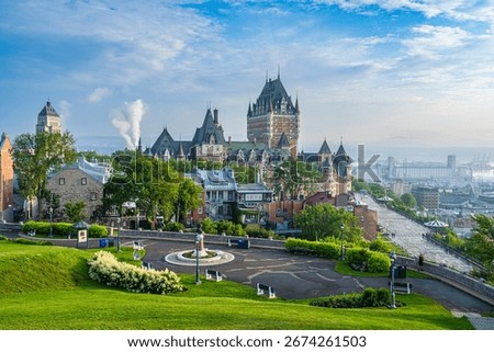 A scenic high-angle view captures the iconic Chateau Frontenac in Quebec City, Canada, under a bright blue sky on 07-07-2023.