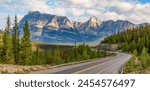 Scenic Highway in Canadian Rocky Mountains. Sunny Cloudy day. Banff, Alberta, Canada.