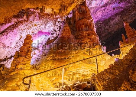 A scenic and illuminated view of the caverns inside Lewis and Clark Caverns State Park is captured, highlighting the stunning geological formations and the unique lighting that enhances their beauty