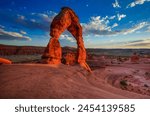 Scenic image of Delicate Arch at sunset.