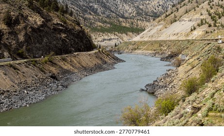 A scenic journey through BC's dramatic transition - from rushing glacial waters of Kicking Horse Canyon to the dry, rugged landscapes of the Thompson river near Kamloops where rail, river, and highway wind together through vast canyon terrain.