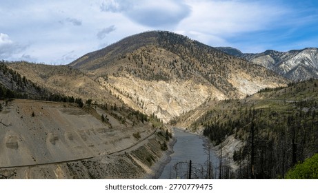 A scenic journey through BC's dramatic transition - from rushing glacial waters of Kicking Horse Canyon to the dry, rugged landscapes of the Thompson river near Kamloops where rail, river, and highway wind together through vast canyon terrain.