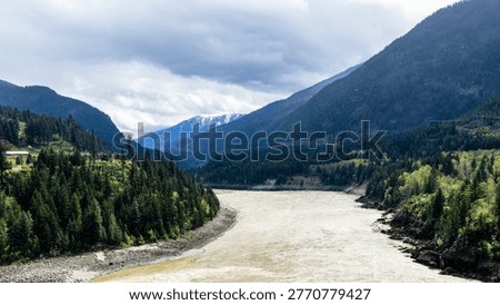 A scenic journey through BC's dramatic transition - from rushing glacial waters of Kicking Horse Canyon to the dry, rugged landscapes of the Thompson river near Kamloops where rail, river, and highway wind together through vast canyon terrain.