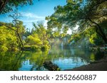 Scenic Kravica Waterfall in Herzegovina Surrounded by Lush Greenery During Summer