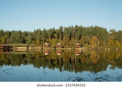 Scenic lakeside houses surrounded by fall foliage. - Powered by Shutterstock