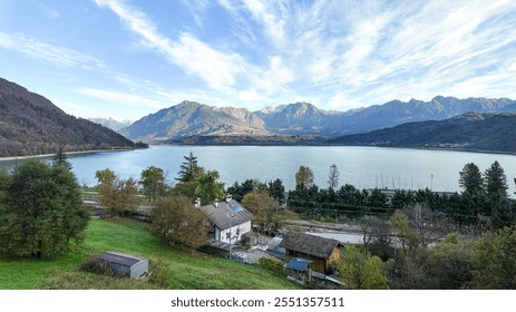 Scenic lakeside view near autumnal Alps mountains, ideal for holiday retreats and nature relaxation with rural European charm Dolomite Alps - Powered by Shutterstock