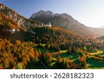 Scenic landscape of Alps mountains famous historic Neuschwanstein castle at Schwangau, Germany in autumn time