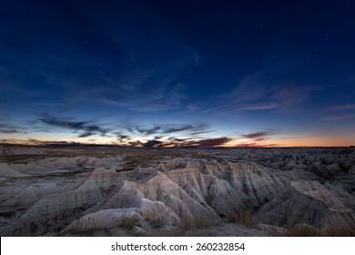 Scenic Landscape Of The Constellation Of Ursa Major, Or Big Bear, Over Eroded Mountains In The Badlands Of South Dakota In A Starry Evening Sky