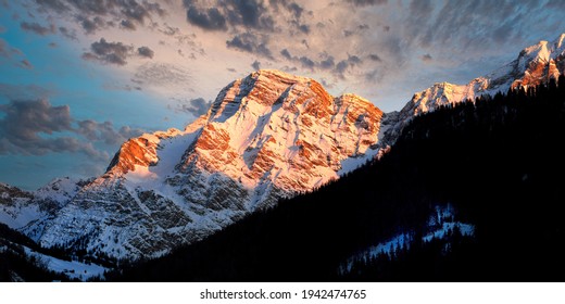 Scenic landscape of the Dolomitic rocky mountain group of Sasso della Croce at sunset. Trentino, Italy.