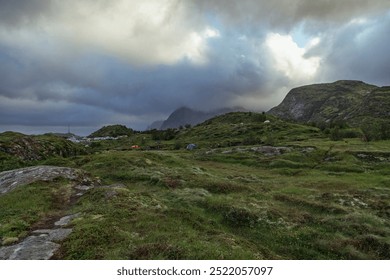 Scenic Landscape of Lofoten Islands Showcasing Grasslands, Mountains, and Dramatic Clouds in Nordland County, Norway - Powered by Shutterstock