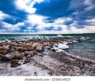 Scenic landscape of northern lights over rocky seashore at sunset - Powered by Shutterstock