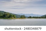 Scenic landscape panorama on picturesque Kaptai lake under moody sky, Rangamati, Chittagong, Bangladesh