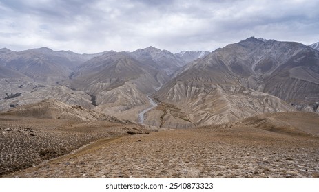 Scenic landscape view of Wakhan mountain range in Afghanistan from high-altitude desert between Langar and Khargush, Gorno-Badakhshan, Tajikistan Pamir - Powered by Shutterstock