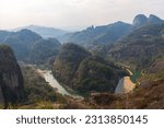 Scenic landscape of Wuyi Mountains peaks and the River of Nine Bends, Fujian province, China. Horizontal image with copy space for text