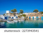 Scenic Mandrakia village (traditional Greek village by the sea, the Cycladic-style) with sirmata - traditional fishermen