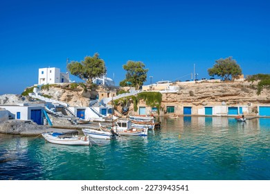 Scenic Mandrakia village (traditional Greek village by the sea, the Cycladic-style) with sirmata - traditional fishermen's houses, Milos island, Cyclades, Greece. - Shutterstock ID 2273943541