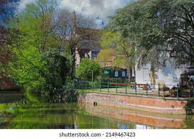 Scenic medieval village water moat canal, waterfront house terrace with green trees - Lier, Belgium