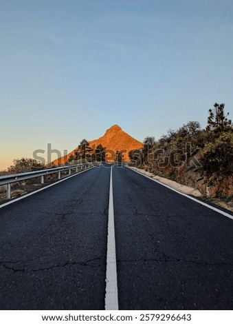 Similar – Image, Stock Photo Sunlit peak of a massive rock formation with the Caminito del Rey path along the side in Malaga