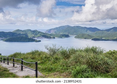 A Scenic Mountain Top View Of Green Islands Formed By The Rim Of An Ancient Super Volcano In The Japan Sea.