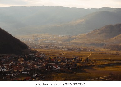 Scenic Mountain Valley with Rural Village and Sunlit Fields is a picturesque and tranquil landscape - Powered by Shutterstock