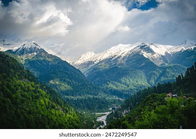 Scenic mountain valley with a winding river and snow-capped peaks in the Parvati Valley, Himachal Pradesh, India. - Powered by Shutterstock