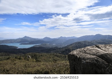 Scenic Mountain View with Rocky Foreground and Distant Lakes - Powered by Shutterstock