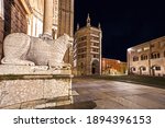 Scenic night view of empty dome place, Parma Cathedral lion statue and baptistery during corona virus pandemic lockdown, Emilia Romagna, Italy