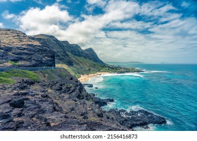 Scenic Oceanfront View Of Makapuu Beach With Road By The Shoreline, Oahu, Hawaii. Rocky Cliffs