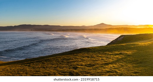 Scenic orange sunset at the beautiful unique Moonee Beach Nature Reserve. Look At Me Now Headland Walk, Coffs Harbour, NSW, Australia	 - Powered by Shutterstock