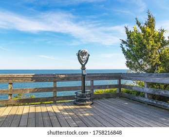 Scenic Overlook Of Ocean With Viewfinder On Wooden Deck At Hammonasset Beach, Madison, CT.