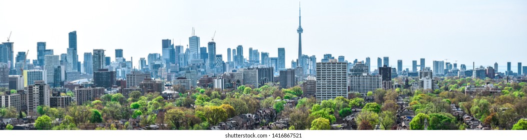 Scenic Panorama Of The Toronto Skyline And Downtown (CBD) Area During Daytime With The Cn Tower And Much Green