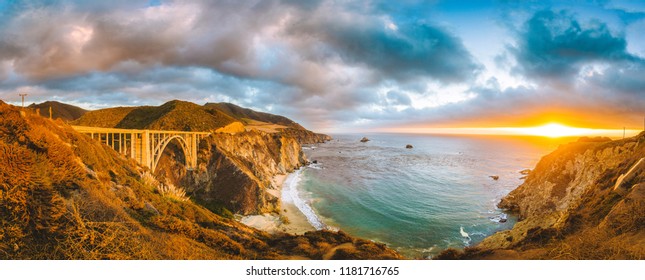 Scenic Panoramic View Of California Central Coast With Historic Bixby Creek Bridge Along World Famous Highway 1 In Beautiful Golden Evening Light At Sunset, Monterey County, California, USA