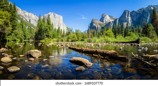 Scenic panoramic view of famous Yosemite Valley with El Capitan rock climbing summit and idyllic Merced river on a beautiful sunny day with blue sky in summer, Yosemite National Park, California, USA - Shutterstock ID 1689107770