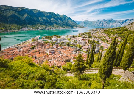 Scenic panoramic view of the historic town of Kotor with famous Bay of Kotor on a beautiful sunny day with blue sky and clouds, Montenegro, Balkans