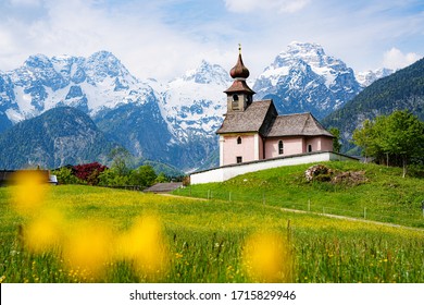 Scenic panoramic view of idyllic Auer Kircherl, an old historical chapel in the alps near the famous old village of Lofer, on a beautiful sunny day with blue sky in spring, Salzburg Land, Austria
