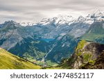 Scenic panoramic view of Oeschinen Lake and village Kandersteg in Bernese Alps, Switzerland. 