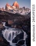 Scenic Patagonian marvel: Fitz Roy, a towering emblem of rugged beauty, pierces the sky amidst pristine wilderness, a hiker